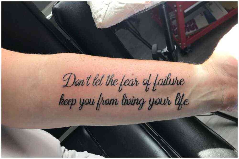 male forearm quote tattoos